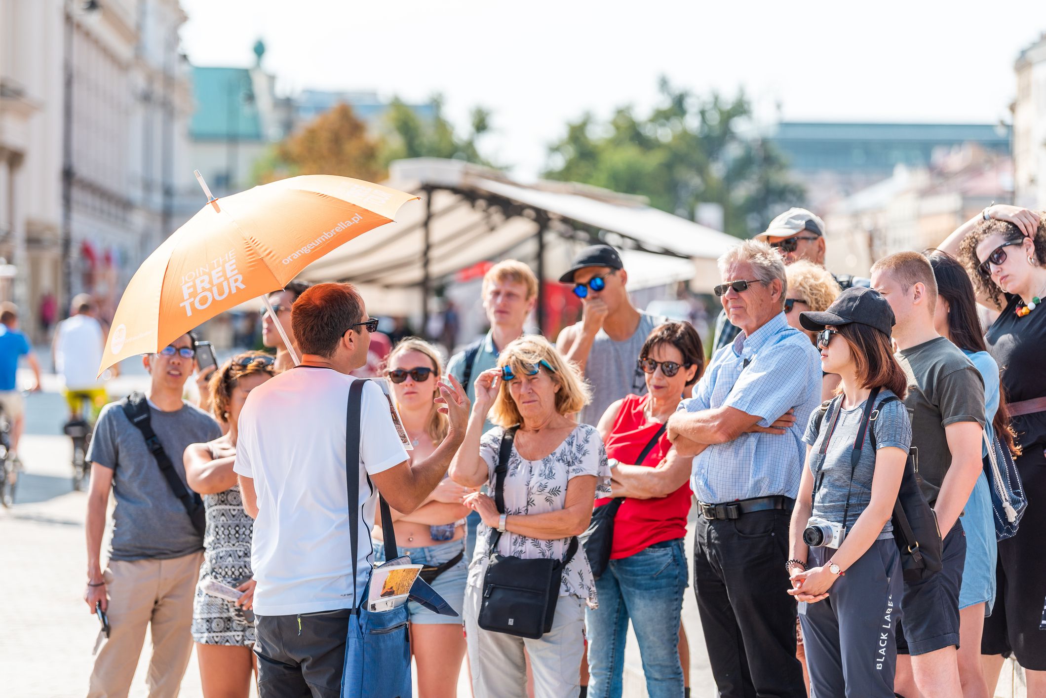 Warsaw, Poland - August 23, 2018: Famous old town historic Castle Square in capital city during sunny summer day crowd of people free tour guide