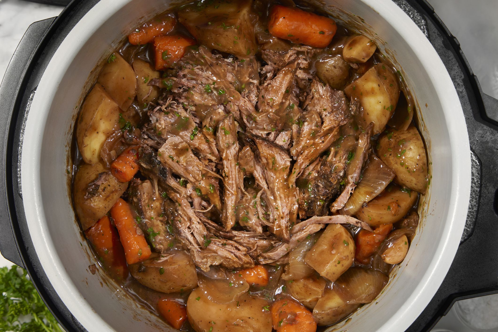 Slow Cooker Pot Roast with Potatoes, Carrots, Celery, Onions and Garlic