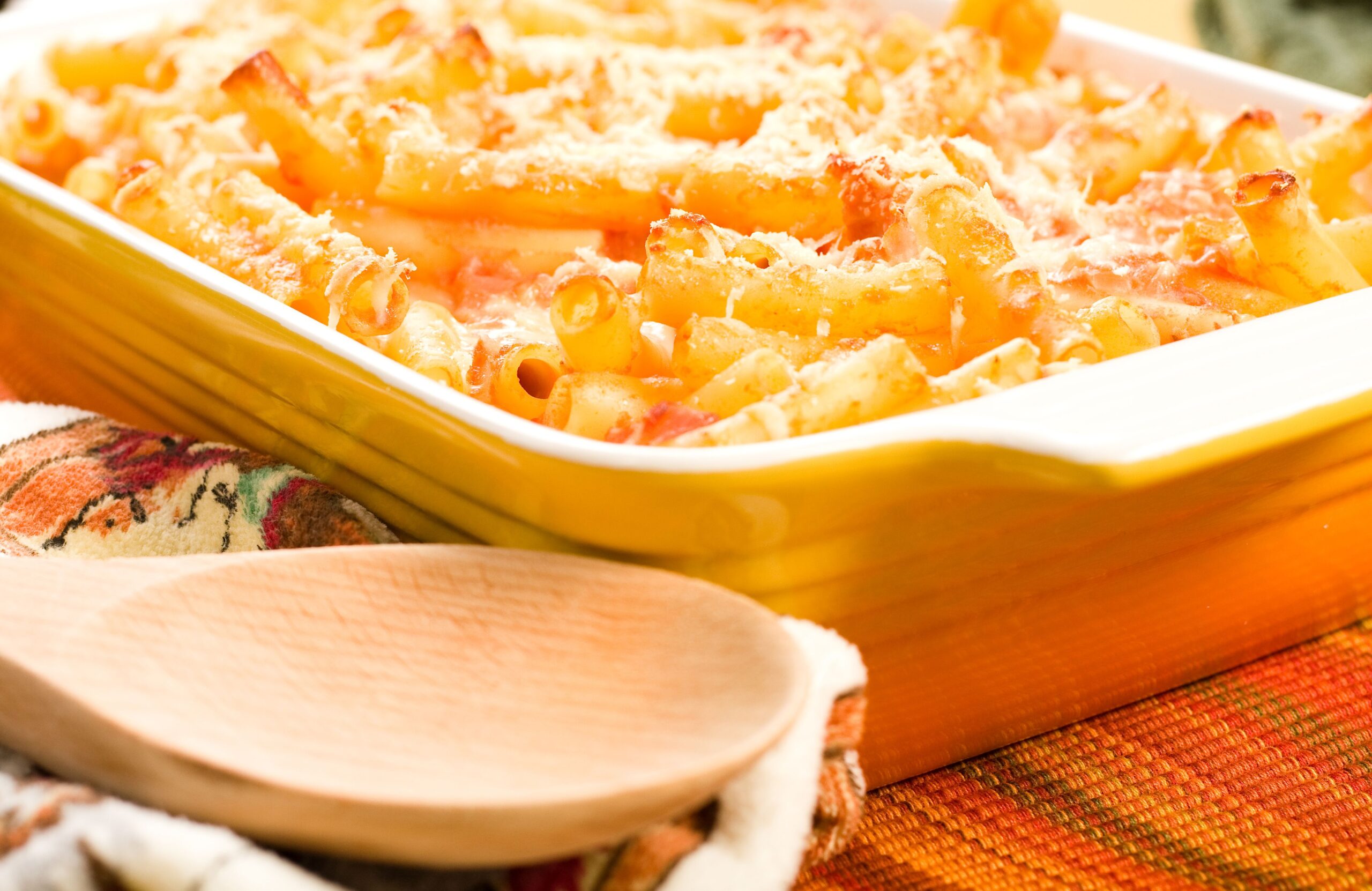 Baked ziti in colorful yellow baking dish