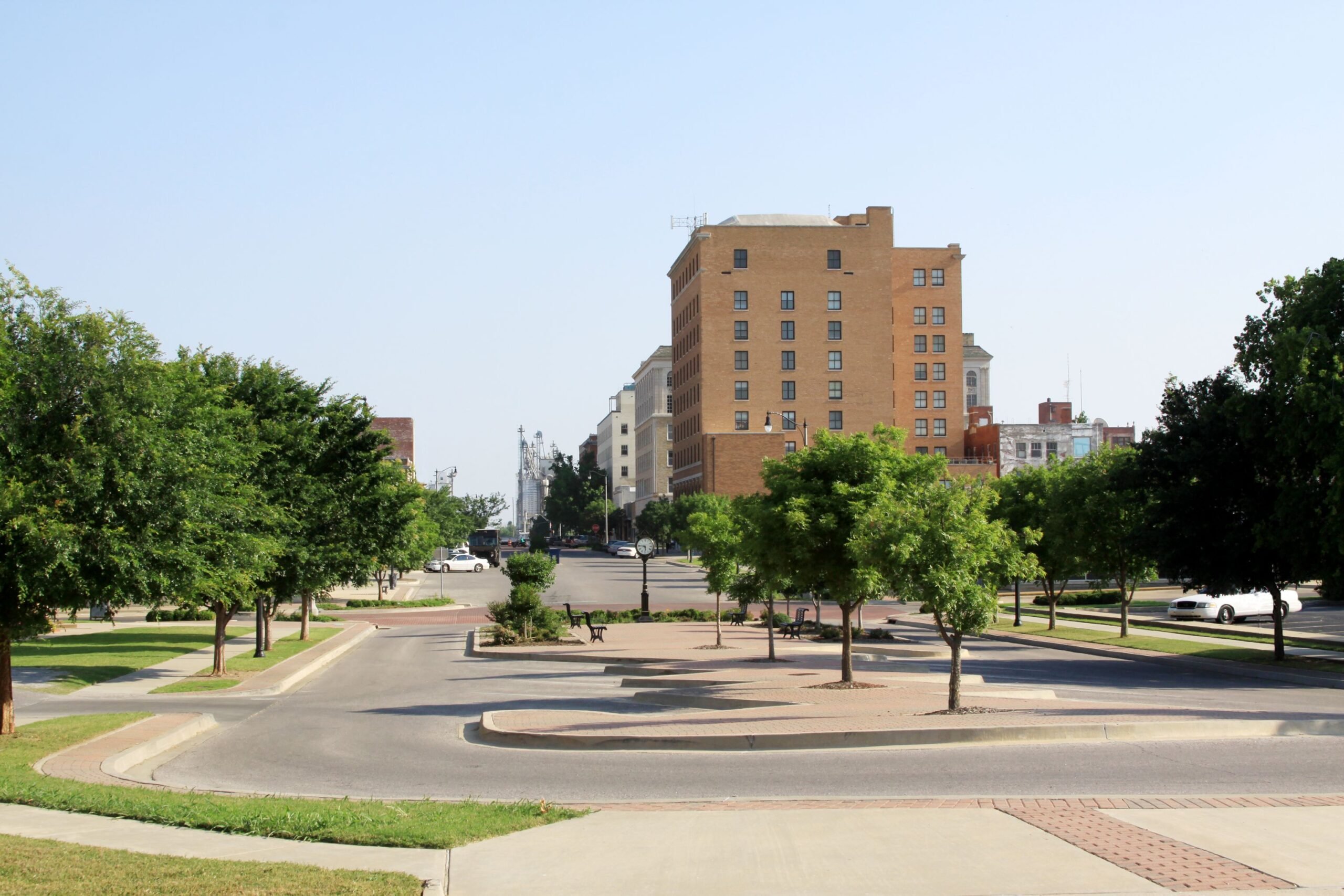 Downtown Shawnee, Oklahoma is photographed on a clear day. Copy space provided.
