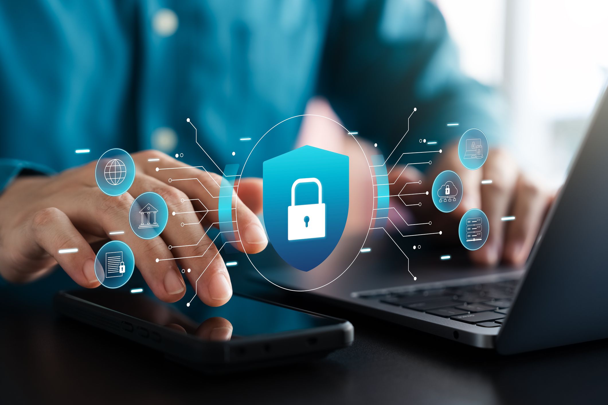 Cyber security and data protection, businessman using laptop and tablet Internet network security system, protecting business financial transaction data from cyber-attacks, secure data encryption.
