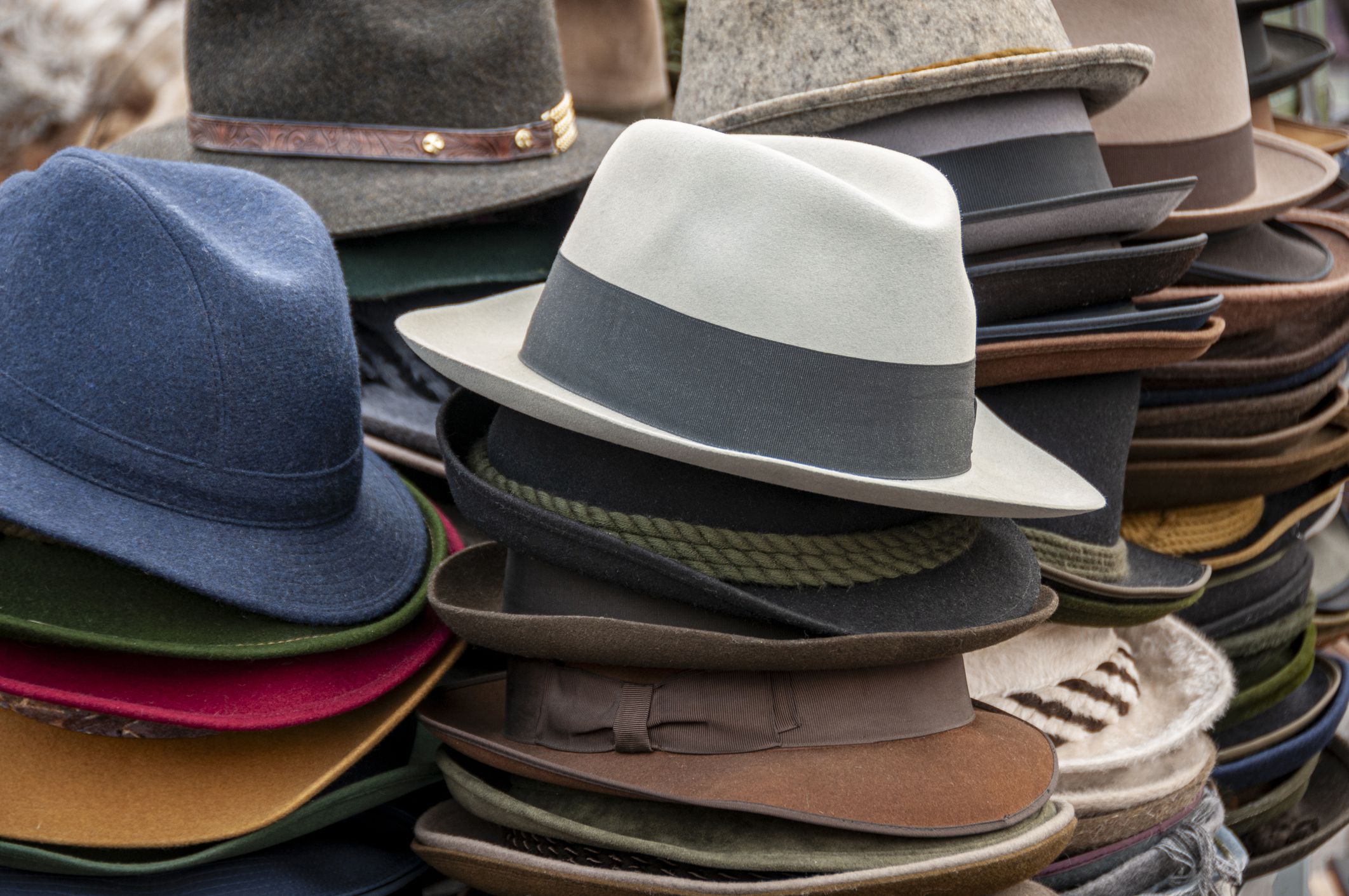 Various traditional hats at a flea market in Vienna.