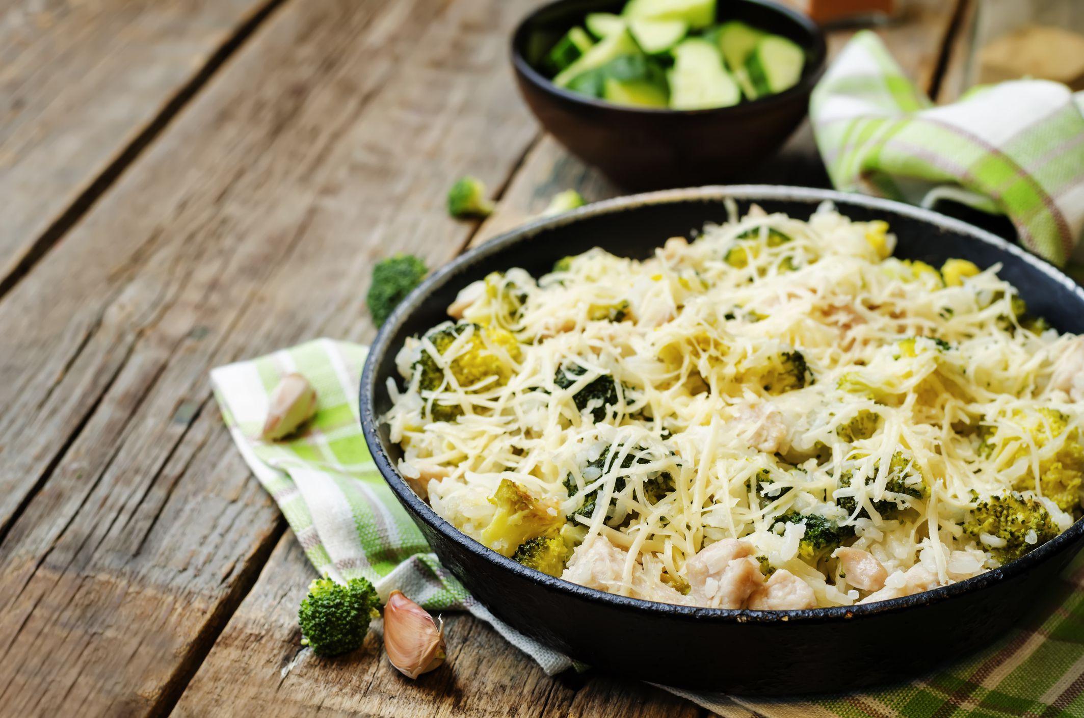 broccoli cheese chicken rice on the dark wood background. the toning. selective focus