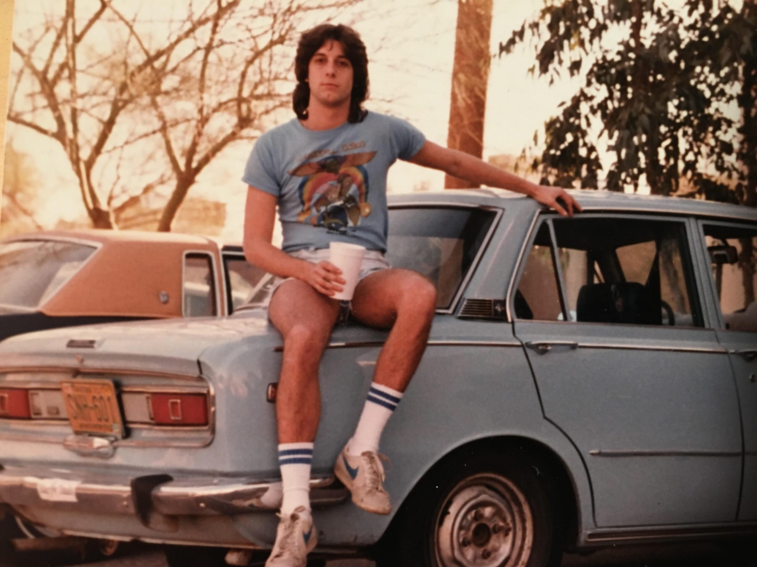 man in the 80s with his first car