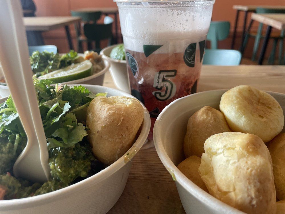 two bowls of food and a cup