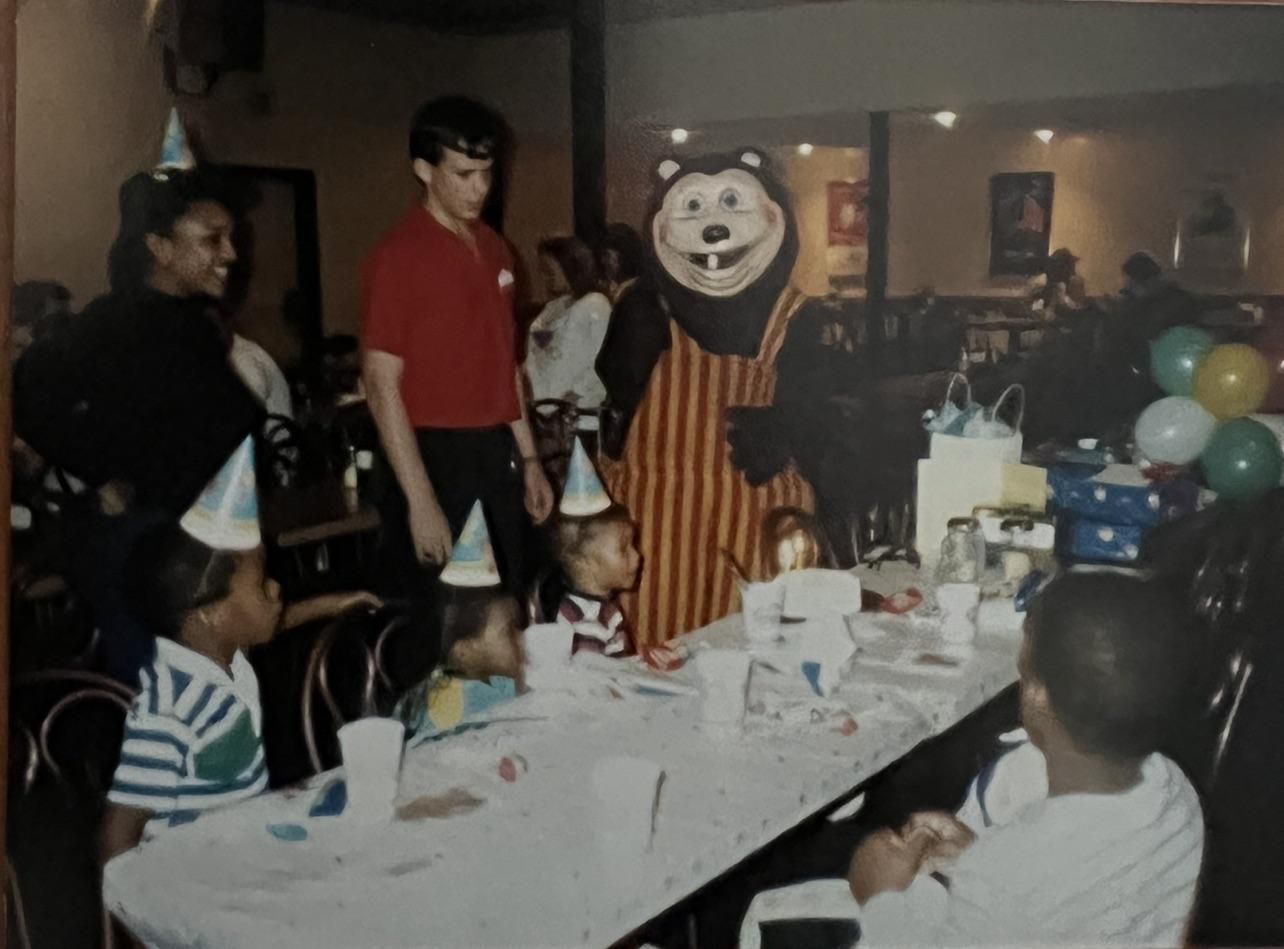 Older brother’s bday party sometime in the late 80s (he’s the one closest to bear). Speaking of which, anybody recognize the bear..? It was one of those kid arcades like Chuck E Cheeses