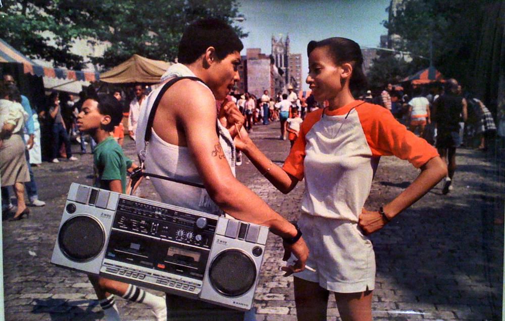 two people in the streets of new york in the 1980s, one has a boom box