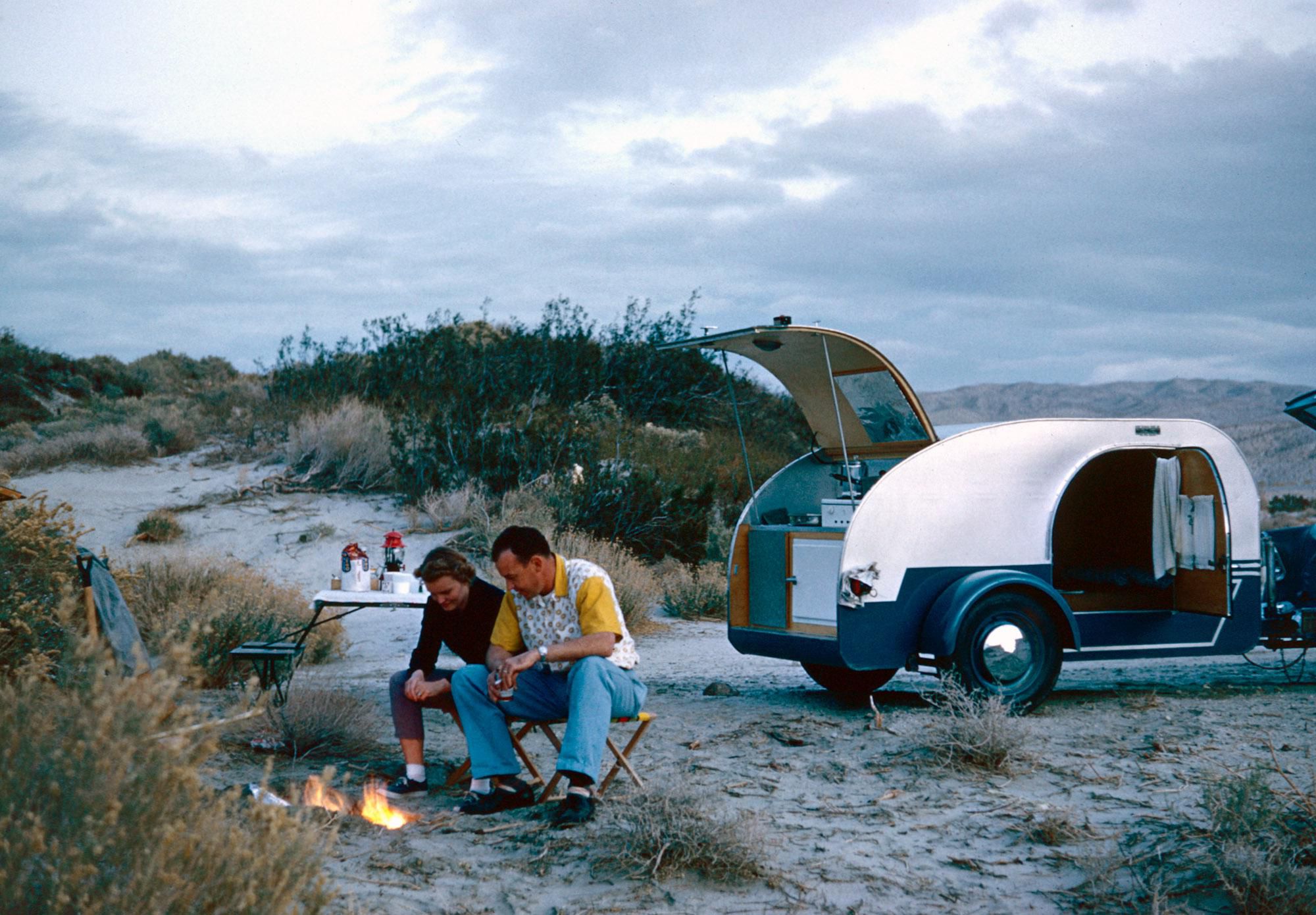 two people camping in the Mojave desert with a teardrop trailer
