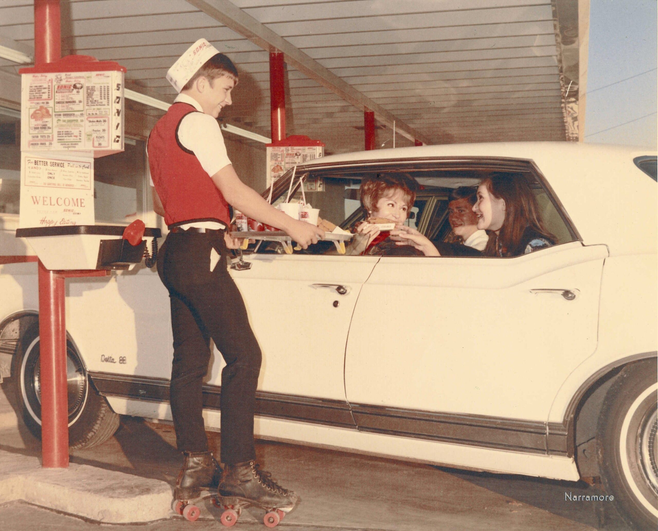 Before McDonald's revolutionised fast food, car hops served food on rollerskates direct to the car. Florida 1967.