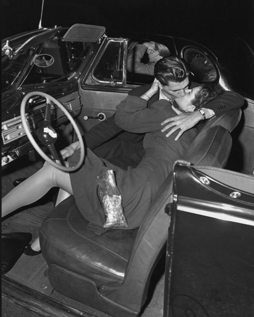 A couple at a drive-in theater, 1960s