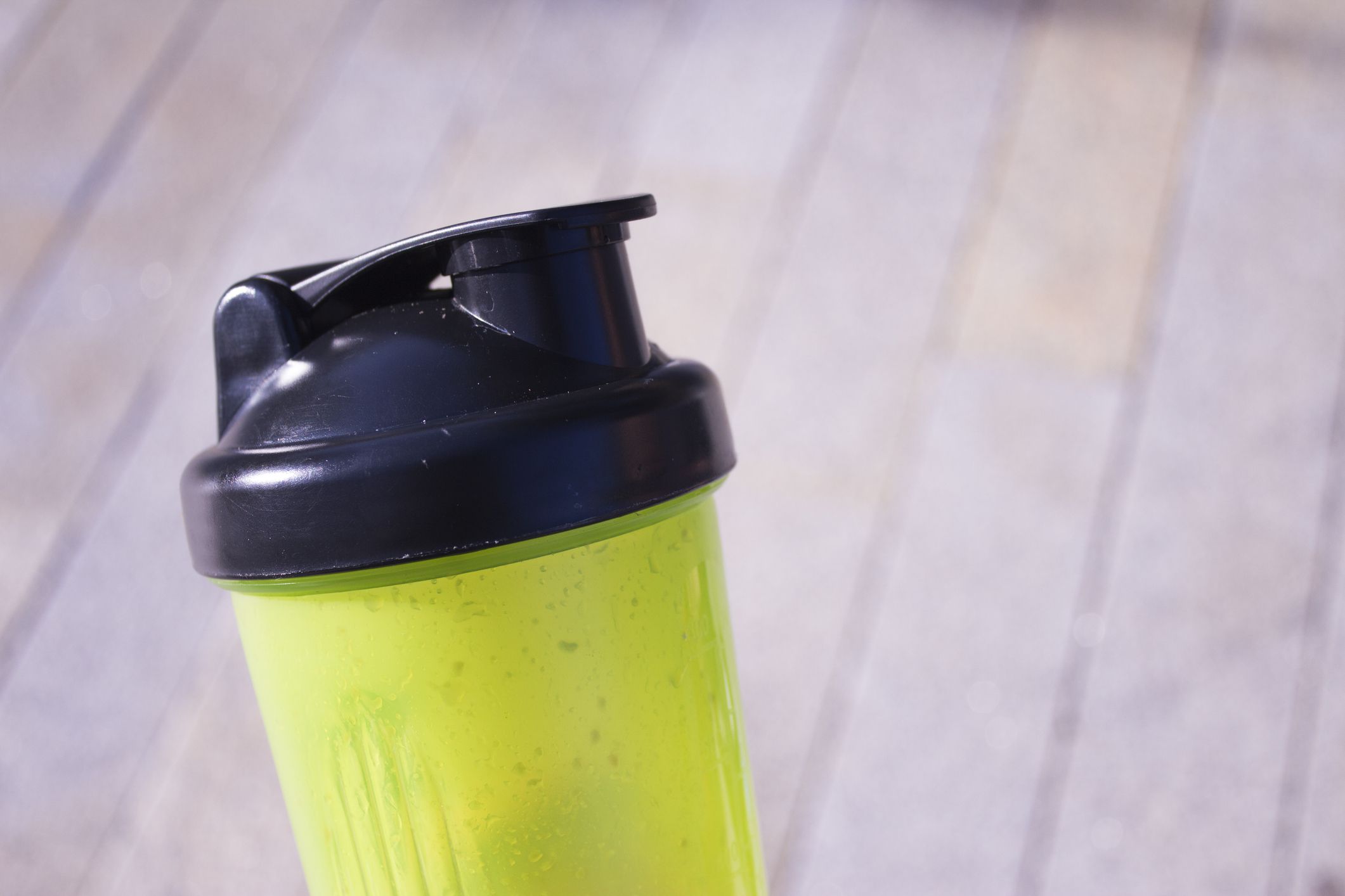 Transparent yellow shaker for sports drinks