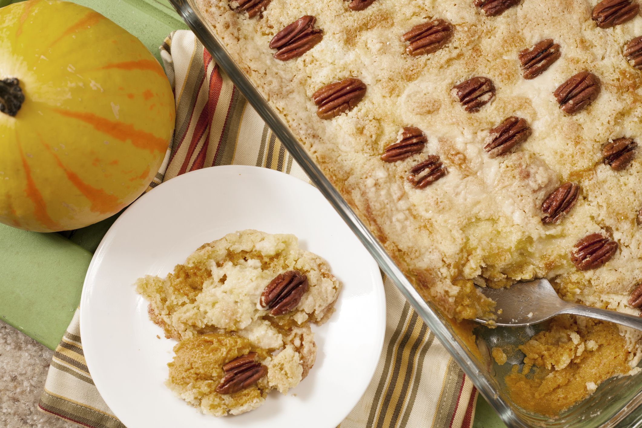 Baked pumpkin cobbler for Thanksgiving dinner. No people in holiday baking scene.