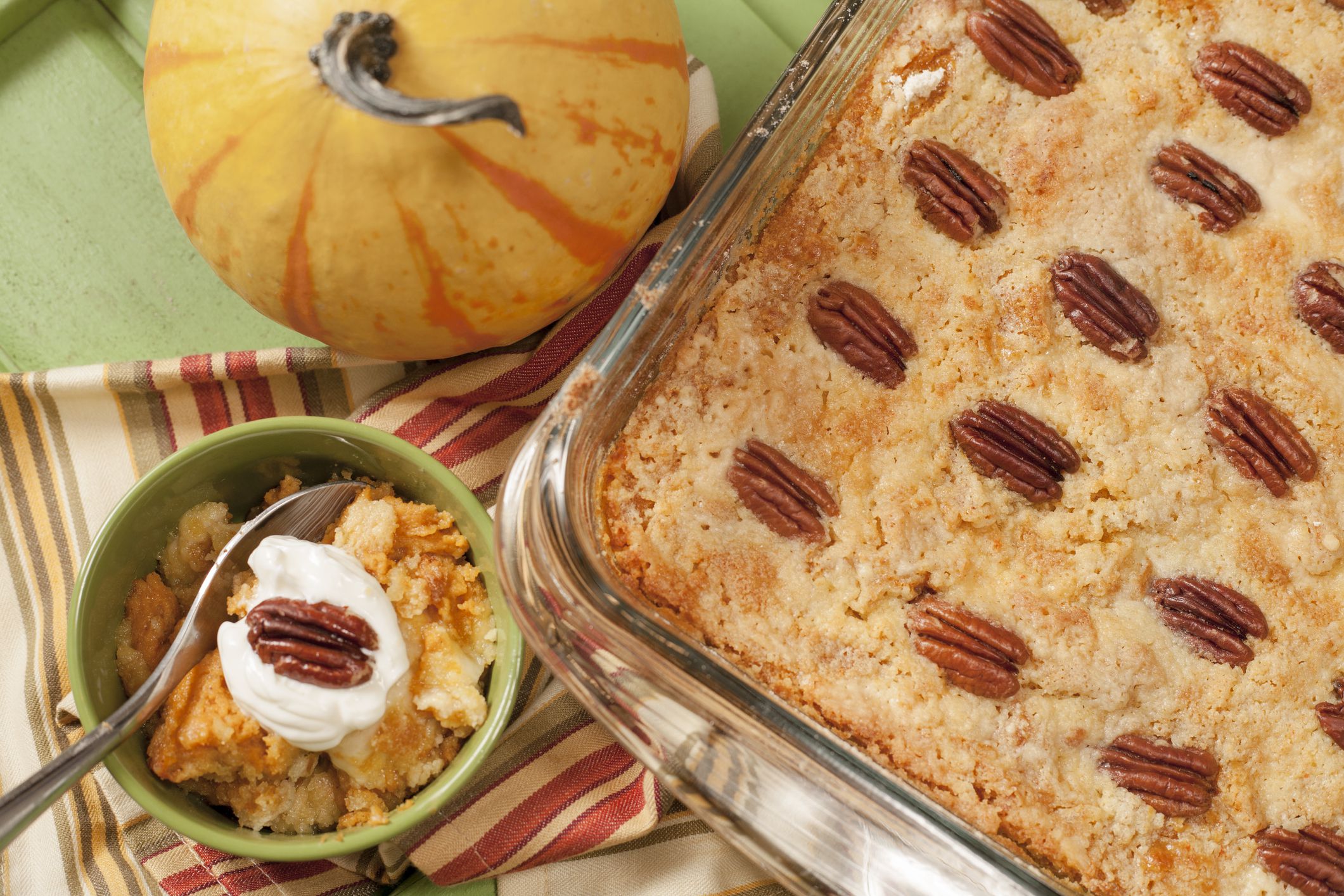 Baked pumpkin cobbler for Thanksgiving dinner. No people in holiday baking scene.