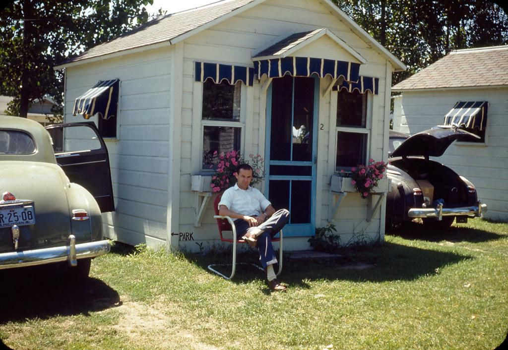 guy in front of a rental cabin in Wisconsin
