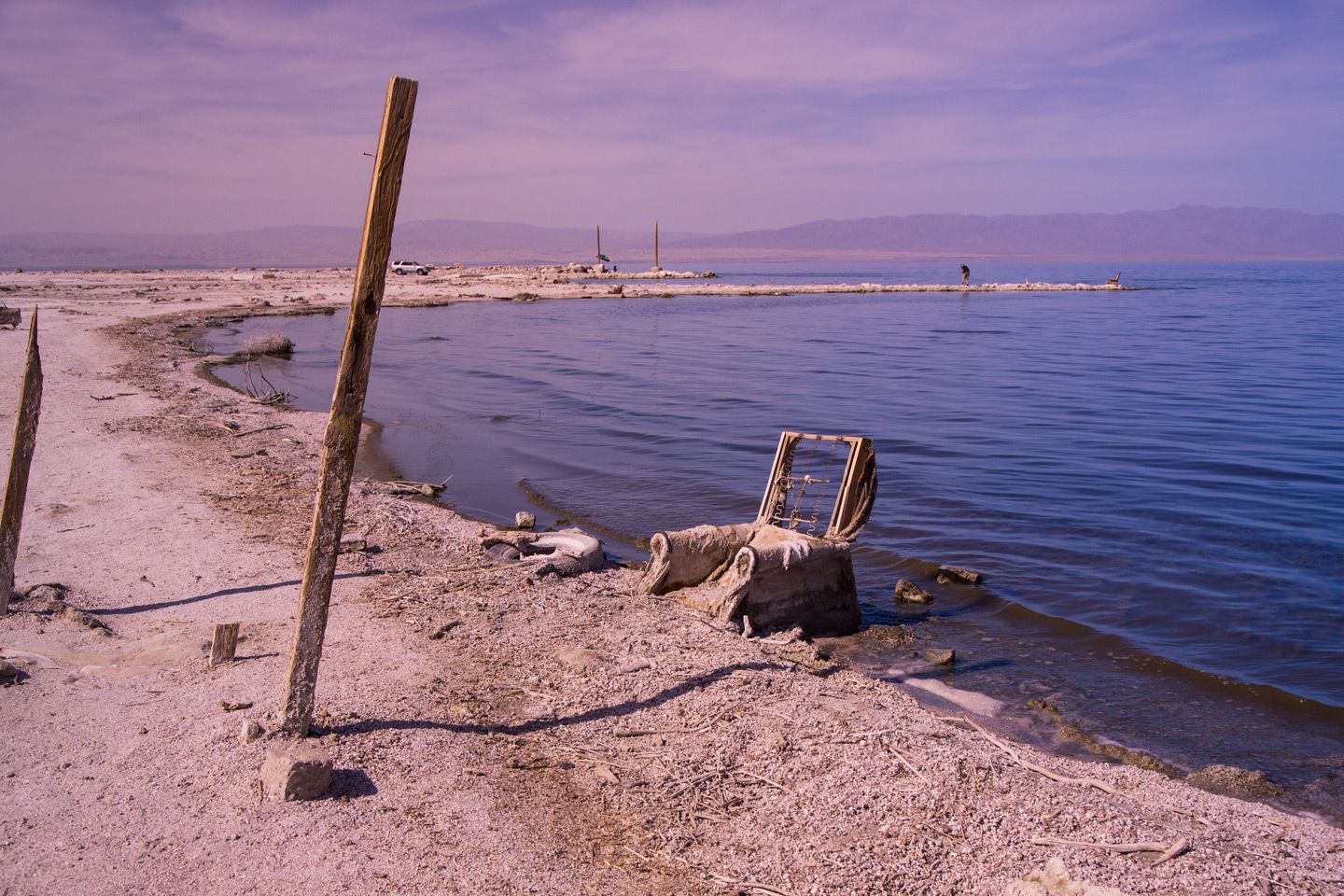 Old chair rotting in the water at modern day Salton Sea