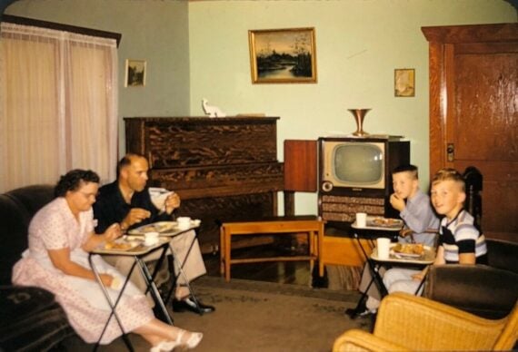 Family eating dinner while watching TV - c.late 1950s