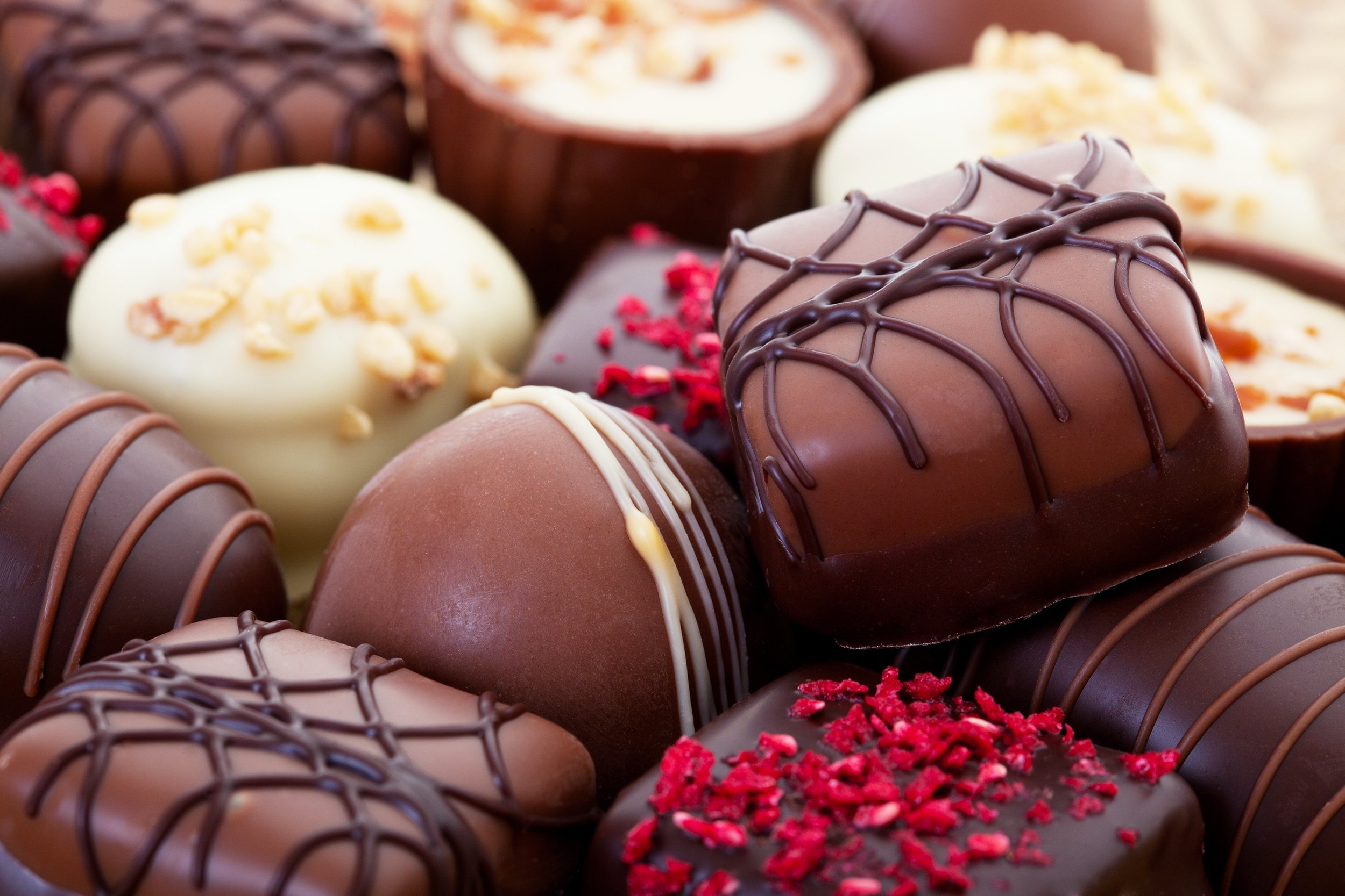assortment of fine chocolates in white, dark, and milk chocolate