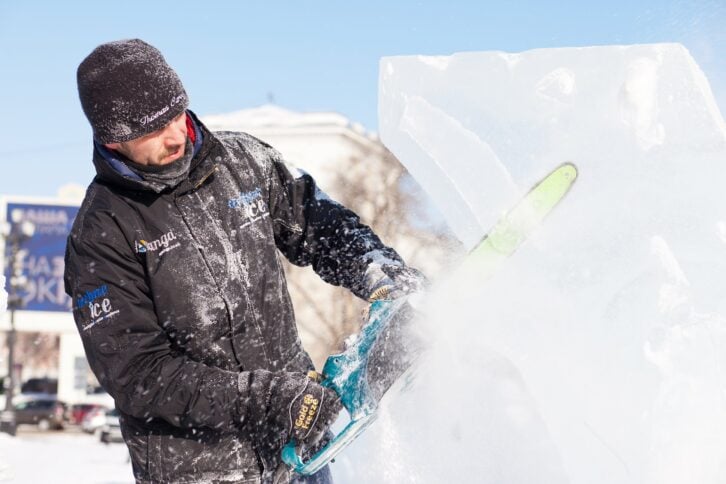sculptor working on ice sculpture