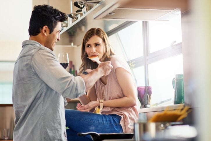 couple cooking in kitchen