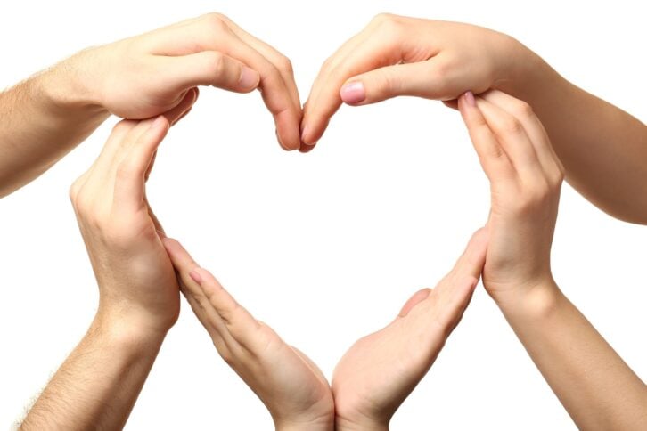 heart formed by male and female hands