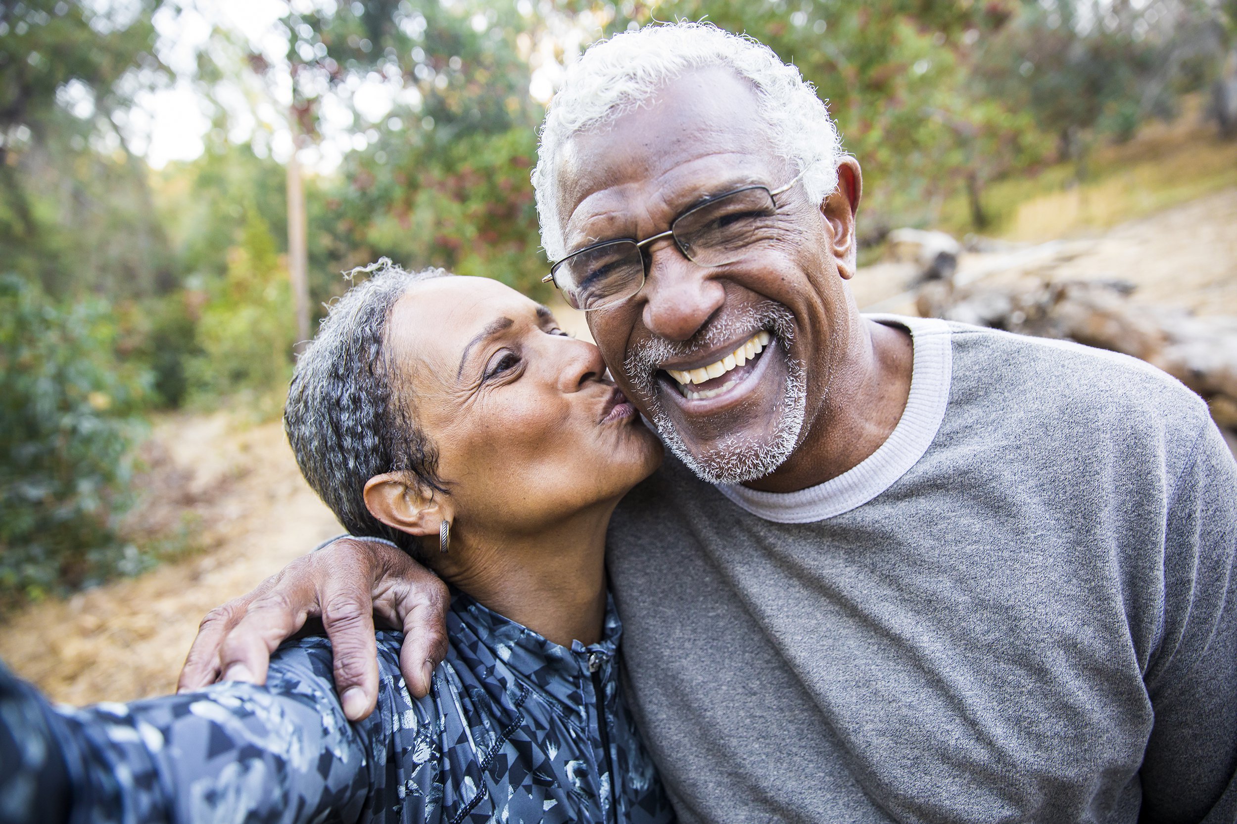 senior African American couple taking selfie during exercise