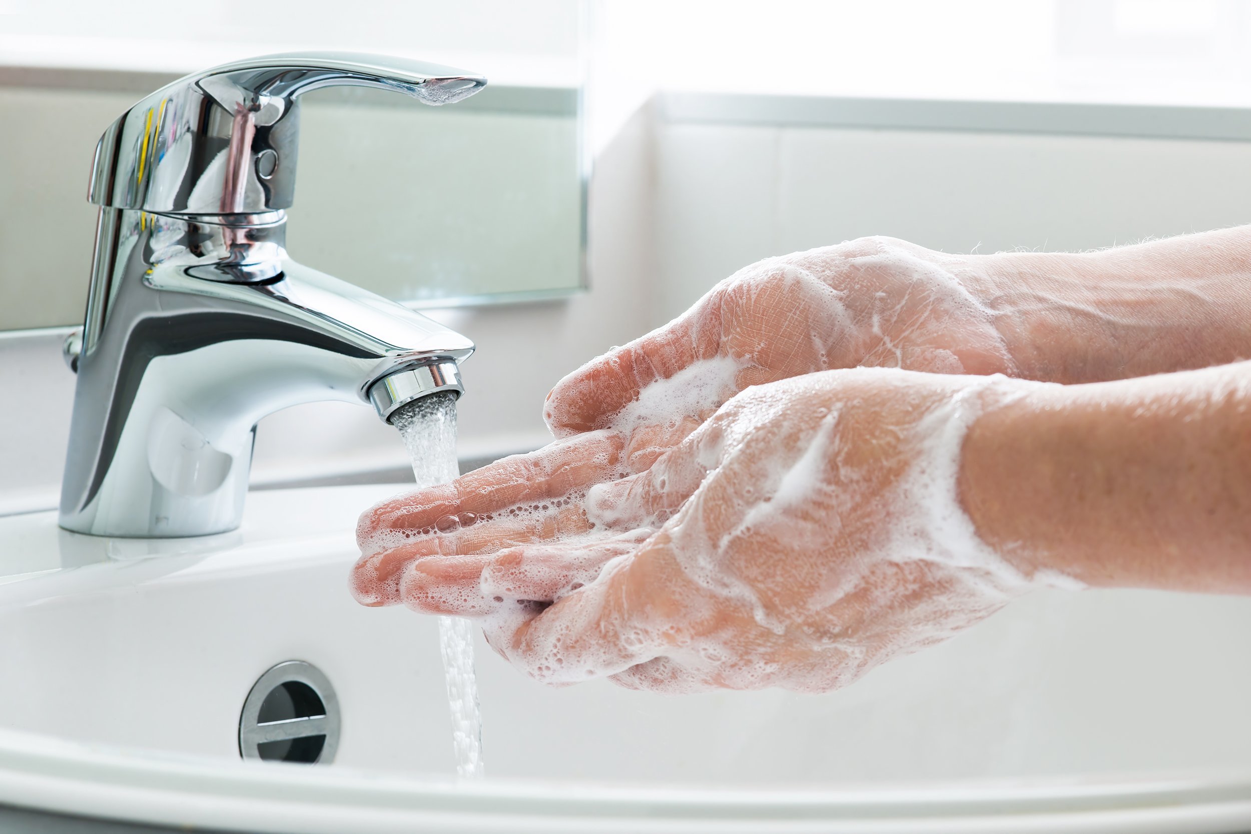 cleaning hands in sink
