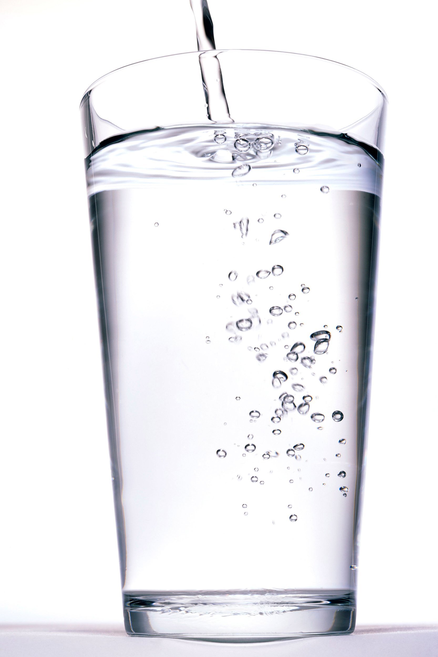 water being poured into glass of water