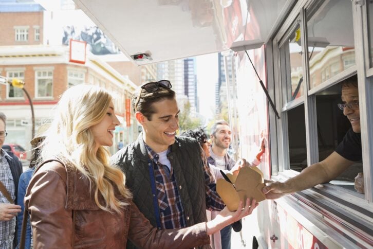 couple ordering from a food truck
