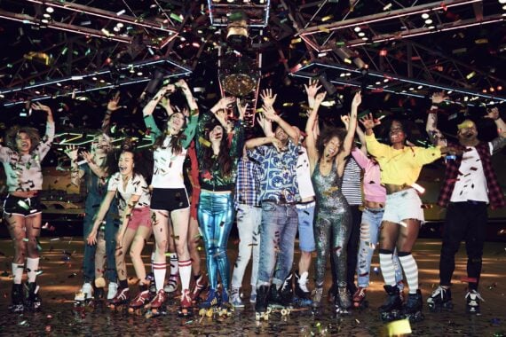 group of friends celebrating at roller disco