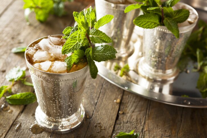 mint juleps on wooden table