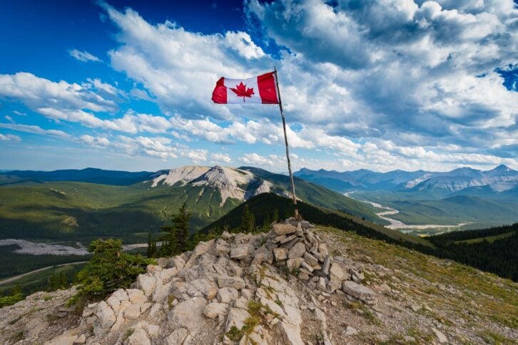 Canadian flag on top of Sunrise Hill, Canadian Rockies, Canada