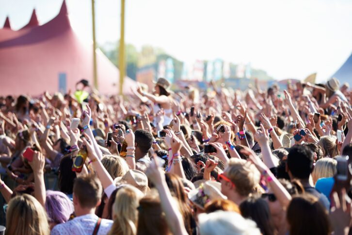 crowds enjoying themselves at outdoor music festival