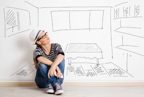 dreaming woman in headset over drawn living room background