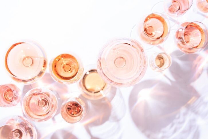 many glasses of rose wine at wine tasting