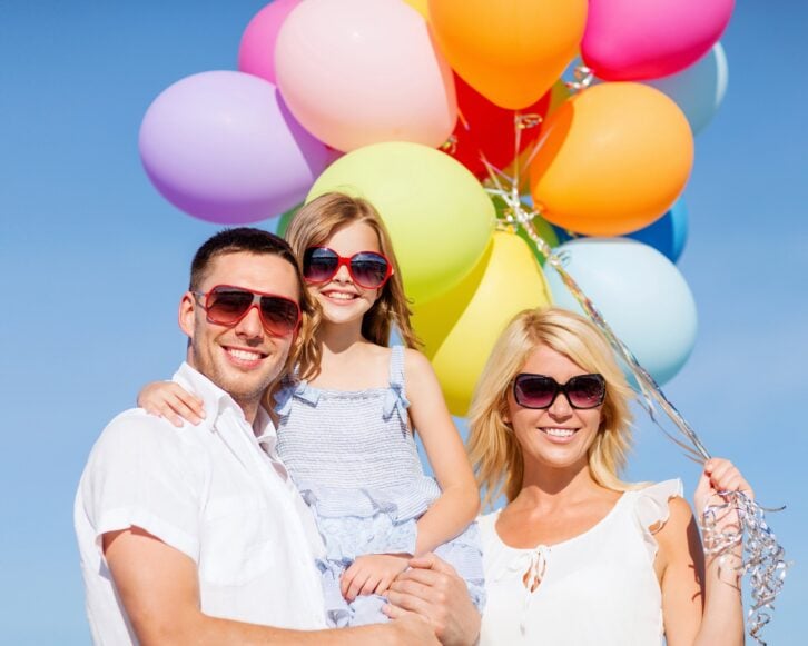 family with colorful balloons