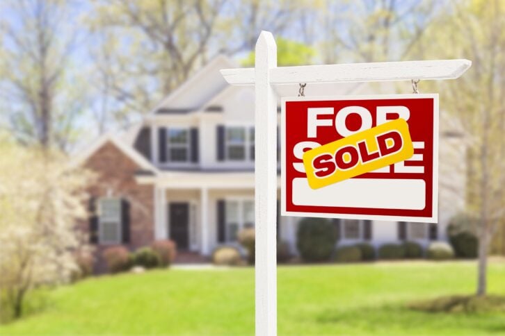 home with sold sign in yard