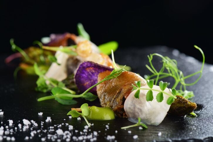 gourmet food scallops with asparagus and lardo bacon
