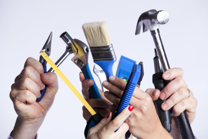 group of people hands with lots of house improvement tools