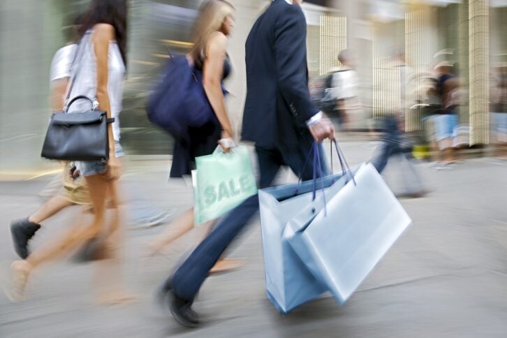 people shopping in the city in motion blur