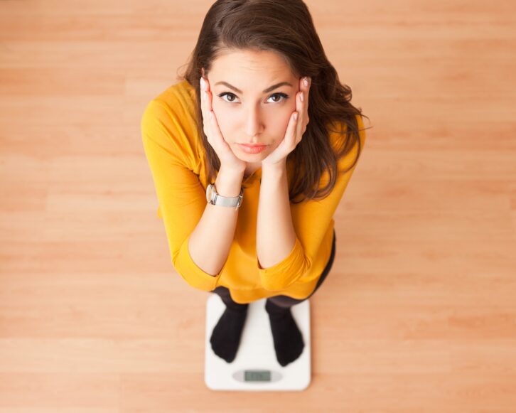 woman standing on a scale