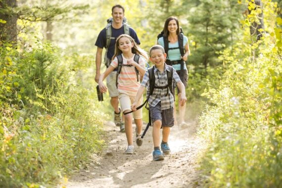 family hiking in the woods