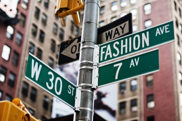 street signs of Fashion Avenue and W 30th in NYC