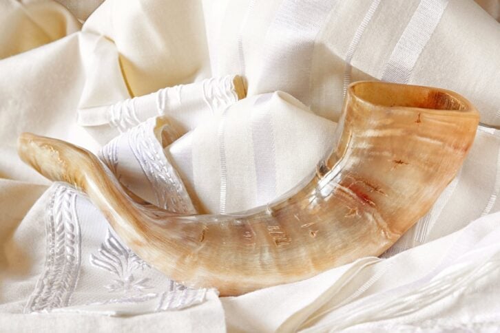 shofar on white prayer talit