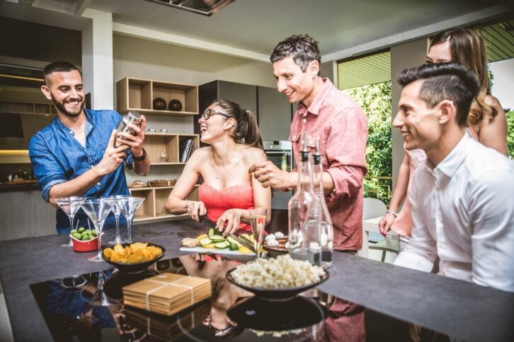 friends having fun and making party at home
