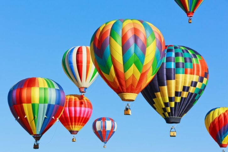 colorful hot air balloons against blue sky