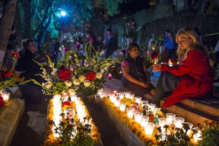 people on a cemetery during Day of the Dead in Oaxaca, Mexico