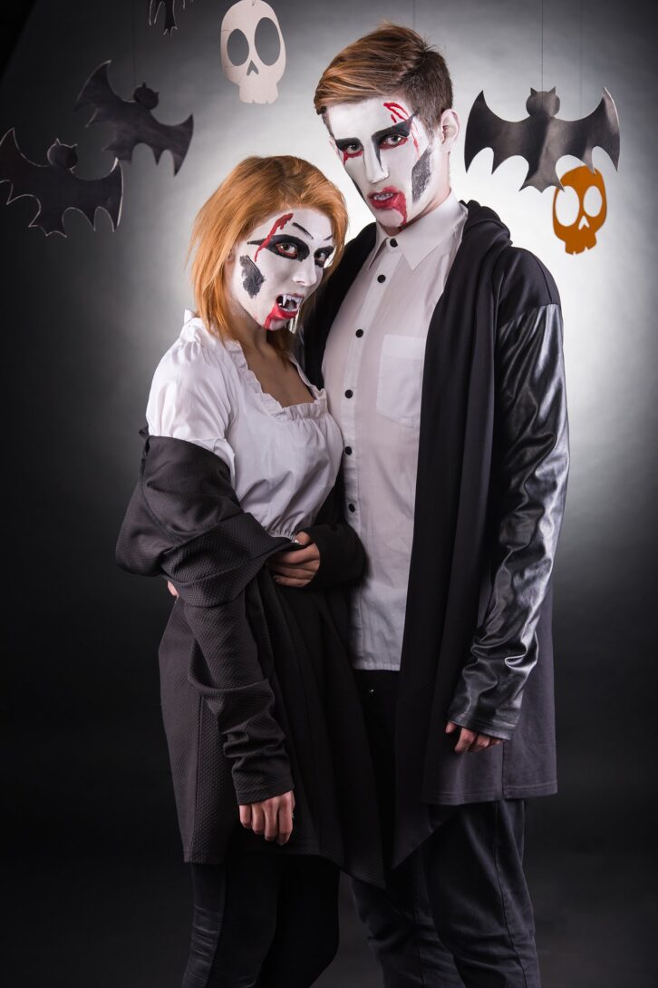 young couple celebrating Halloween in costume