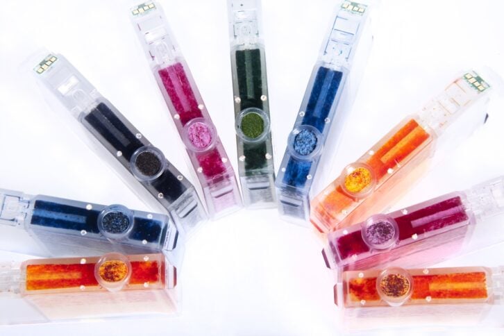 an array of colorful inkjet printer cartridges