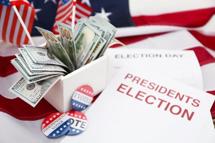 ballot for presidents election 2016 and many dollar banknotes on stars and stripes background