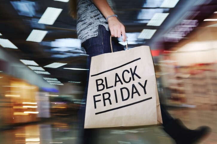 moving shopper with Black Friday bag